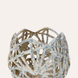 Decorative candle holder in pale blue ceramic