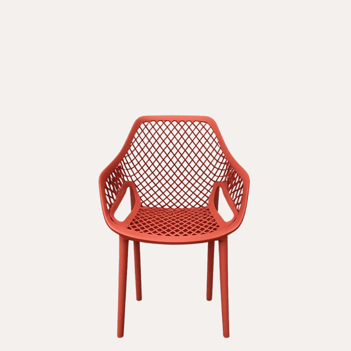 Poltrona Traforata in Polipropilene Rosso Corallo Opaco 56x60x82 cm